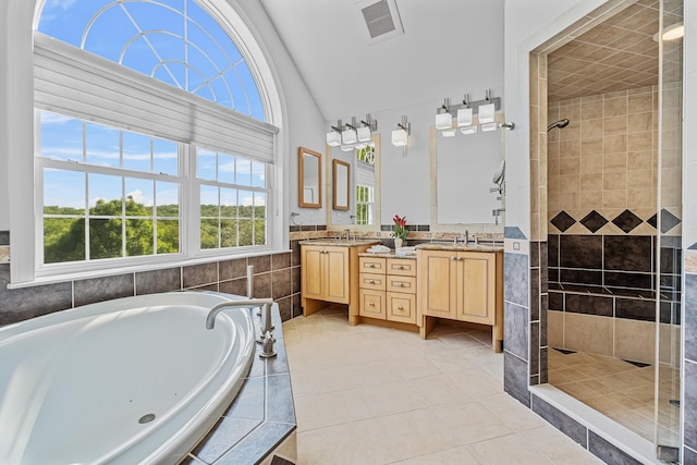 37 Shallow Stream Rd, Carmel, NY 10512 - bathroom with vaulted ceiling, a tile shower, healthy amount of natural light, a garden tub, and vanity