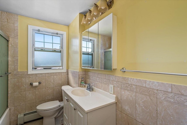 bathroom featuring tile walls, toilet, vanity, a baseboard radiator, and wainscoting