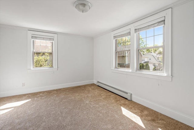 carpeted empty room with baseboards, a baseboard radiator, and crown molding