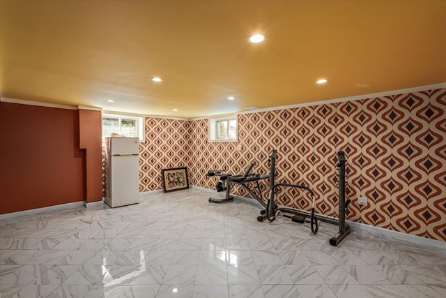 interior space with baseboards, ornamental molding, and recessed lighting