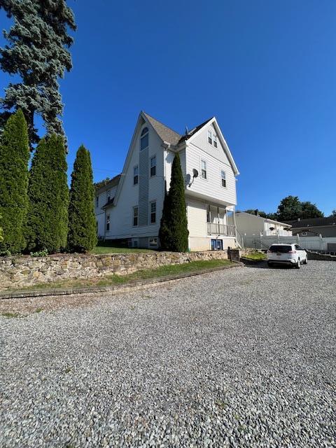 317 Elwood Ave, Hawthorne, NY 10532 - view of side of property with gravel driveway
