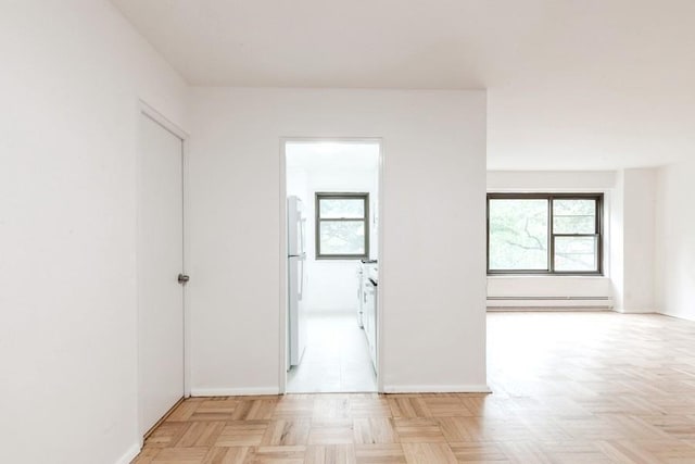 21-55 34th Ave Unit 3C, Long Island City, NY 11106 - spare room with baseboard heating and baseboards