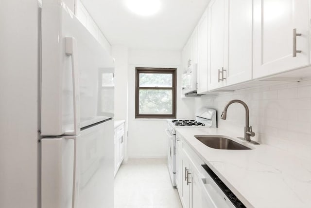 21-55 34th Ave Unit 3C, Long Island City, NY 11106 - kitchen featuring white appliances, a sink, backsplash, and white cabinets