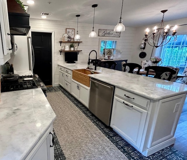 23 Candlestick Ct, Warwick, NY 10990 - kitchen with stainless steel appliances, open shelves, a sink, a peninsula, and white cabinets