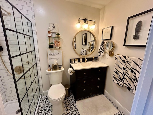 23 Candlestick Ct, Warwick, NY 10990 - bathroom with tiled shower, toilet, vanity, baseboards, and tile patterned floors