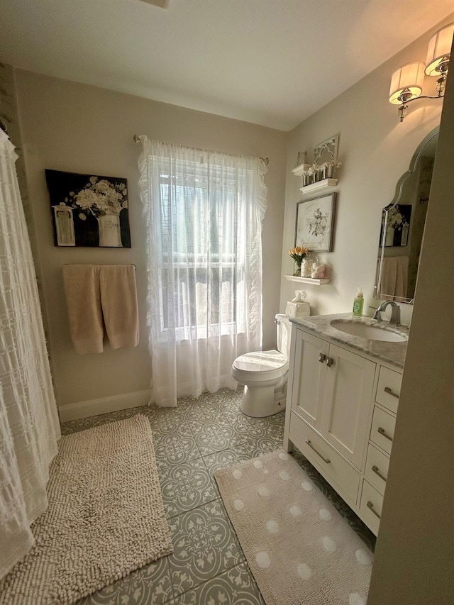 23 Candlestick Ct, Warwick, NY 10990 - bathroom with toilet, vanity, and baseboards