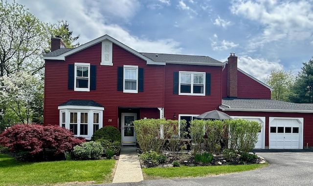 23 Candlestick Ct, Warwick, NY 10990 - view of front of property featuring a chimney, an attached garage, and driveway