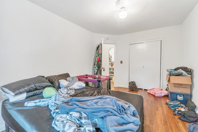 bedroom with a closet and wood finished floors