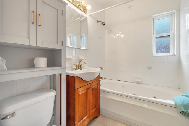 bathroom with toilet, tile walls, vanity, and a combined bath / shower with jetted tub