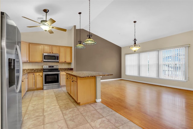 606 Narragansett Villas Dr Unit 606, Lindenhurst, NY 11757 - kitchen featuring appliances with stainless steel finishes, light brown cabinets, a ceiling fan, tasteful backsplash, and a kitchen island