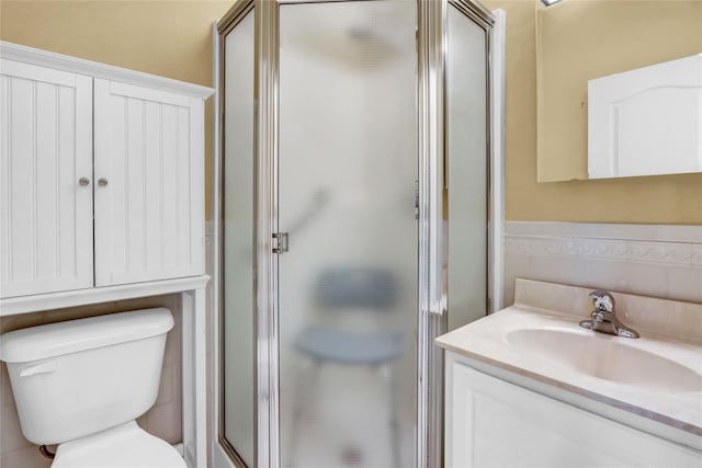 606 Narragansett Villas Dr Unit 606, Lindenhurst, NY 11757 - full bathroom with vanity, toilet, a stall shower, and tile walls
