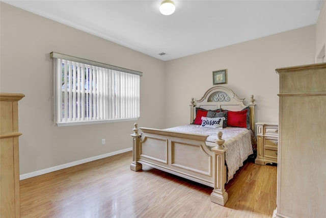 606 Narragansett Villas Dr Unit 606, Lindenhurst, NY 11757 - bedroom featuring light wood-style floors and baseboards