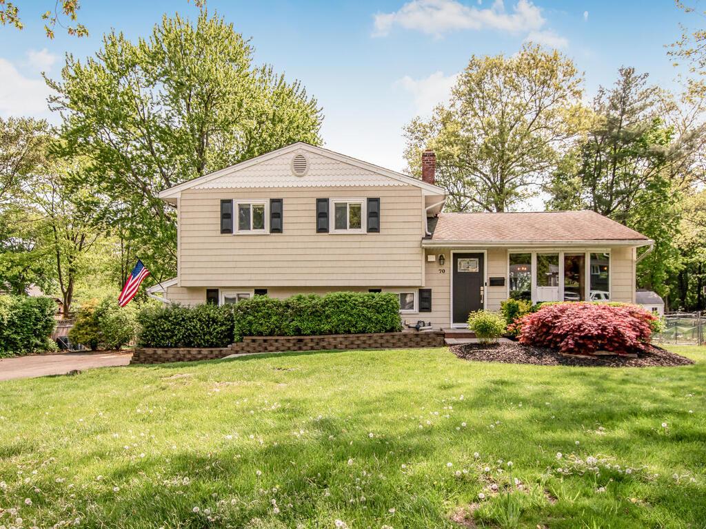 70 Lyncrest Ave, New City, NY 10956 - tri-level home with a chimney and a front yard