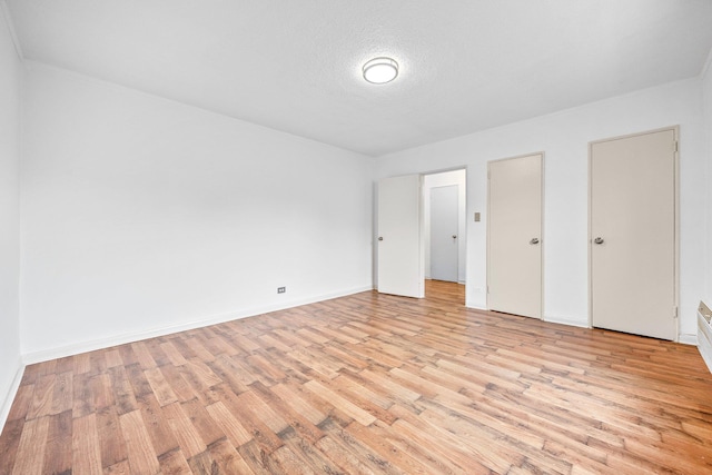 70-07 E Park Dr Unit A, Kew Garden Hills, NY 11367 - unfurnished bedroom with light wood-style flooring and baseboards