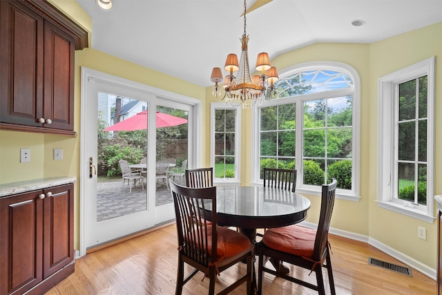 287 Old Army Rd, Scarsdale, NY 10583 - dining space featuring healthy amount of natural light, a chandelier, lofted ceiling, light wood finished floors, and baseboards