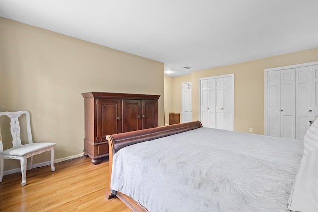 287 Old Army Rd, Scarsdale, NY 10583 - bedroom with light wood-style flooring, baseboards, and two closets