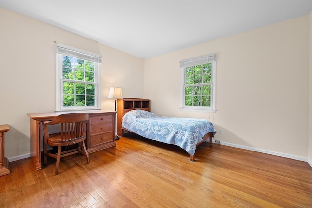 287 Old Army Rd, Scarsdale, NY 10583 - bedroom featuring light wood-style floors, multiple windows, and baseboards