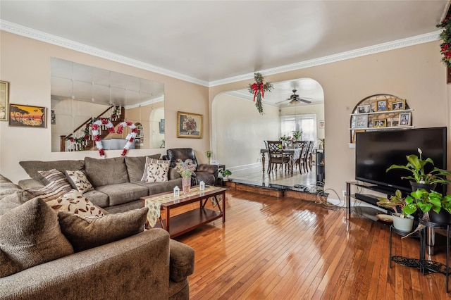 84-17 25th Ave, East Elmhurst, NY 11370 - living area featuring arched walkways, crown molding, wood-type flooring, and a ceiling fan