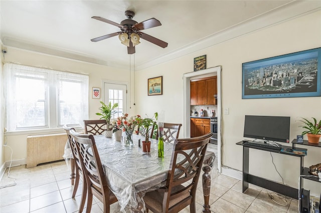 84-17 25th Ave, East Elmhurst, NY 11370 - dining space with crown molding, light tile patterned floors, baseboards, and ceiling fan