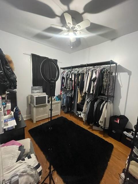 84-17 25th Ave, East Elmhurst, NY 11370 - exercise area with a ceiling fan and wood finished floors