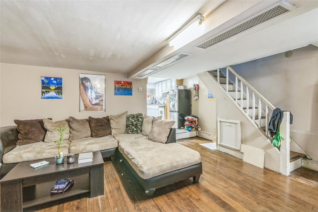 84-17 25th Ave, East Elmhurst, NY 11370 - living area with visible vents, wood finished floors, and stairs