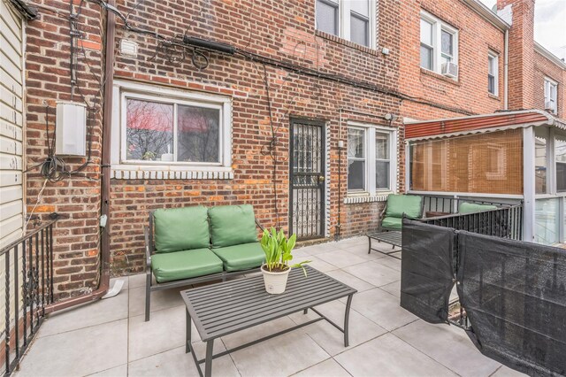 84-17 25th Ave, East Elmhurst, NY 11370 - view of patio featuring outdoor lounge area and cooling unit