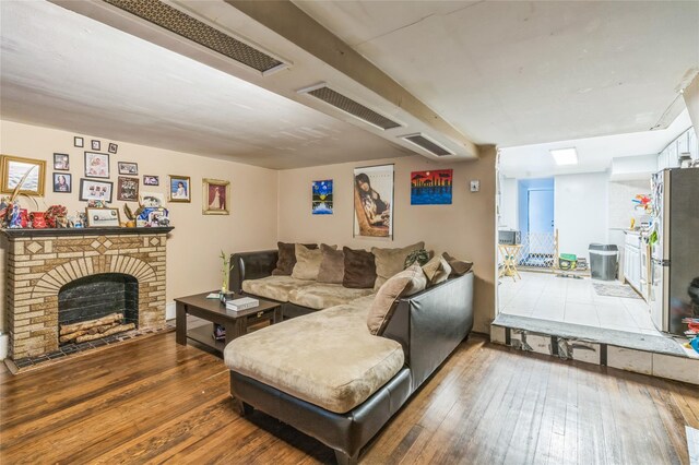 84-17 25th Ave, East Elmhurst, NY 11370 - living area featuring wood-type flooring and a fireplace