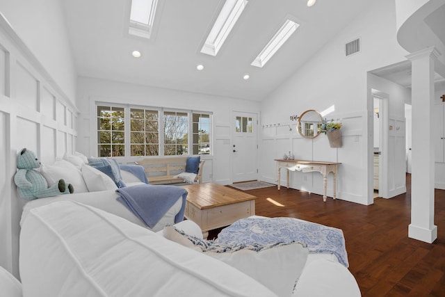 26 Forte Ave, Old Bethpage, NY 11804 - living room with a skylight, high vaulted ceiling, wood finished floors, recessed lighting, and baseboards