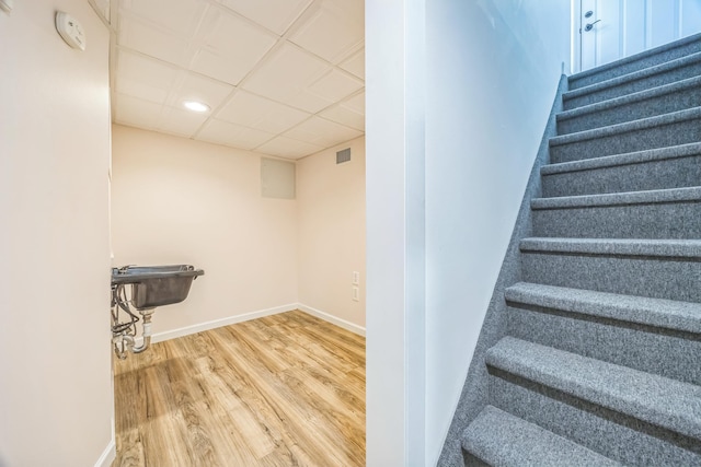 26 Forte Ave, Old Bethpage, NY 11804 - staircase featuring wood finished floors, recessed lighting, baseboards, and a drop ceiling