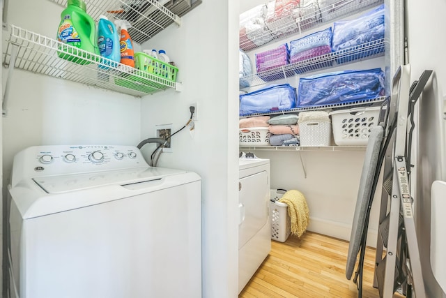 26 Forte Ave, Old Bethpage, NY 11804 - laundry room featuring hardwood / wood-style floors, separate washer and dryer, and baseboards