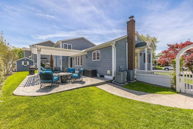 26 Forte Ave, Old Bethpage, NY 11804 - rear view of property with a pergola, a chimney, a patio, and central air condition unit