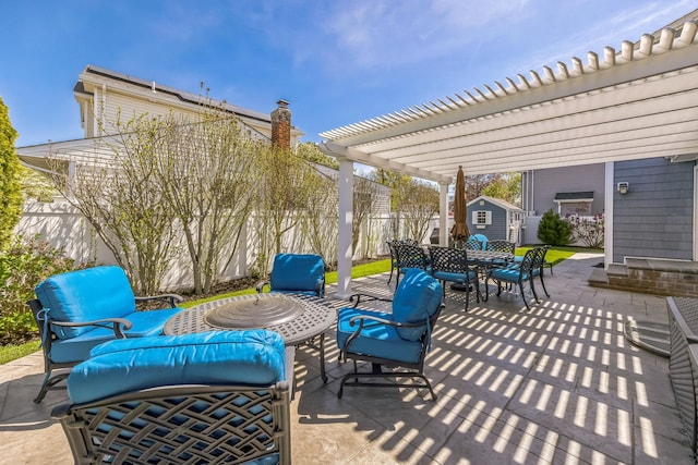 26 Forte Ave, Old Bethpage, NY 11804 - view of patio / terrace with a storage unit, a pergola, an outbuilding, a fenced backyard, and outdoor dining space