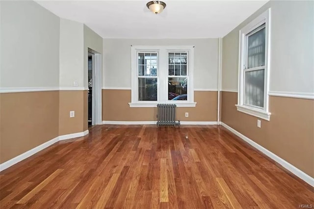 4565 Matilda Ave, Bronx, NY 10470 - empty room with baseboards, radiator heating unit, and wood finished floors