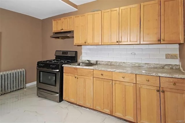 4565 Matilda Ave, Bronx, NY 10470 - kitchen featuring under cabinet range hood, marble finish floor, radiator heating unit, gas stove, and a sink