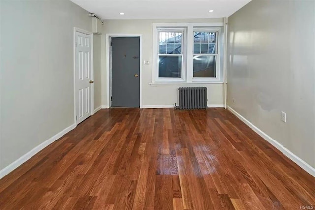 4565 Matilda Ave, Bronx, NY 10470 - unfurnished room featuring recessed lighting, radiator, baseboards, and wood finished floors