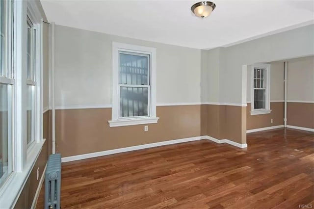 4565 Matilda Ave, Bronx, NY 10470 - spare room with wood finished floors, baseboards, and radiator heating unit
