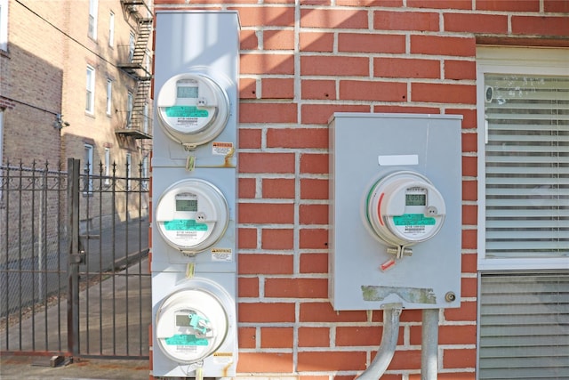 details featuring fence and electric meter