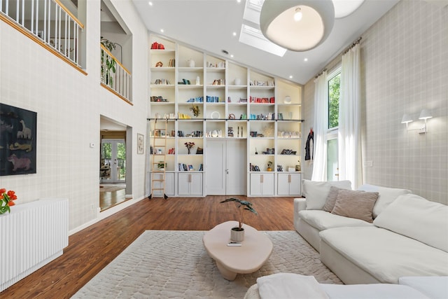 10 Spectrum Dr, Chester, NY 10918 - living room with wallpapered walls, healthy amount of natural light, high vaulted ceiling, wood finished floors, and recessed lighting