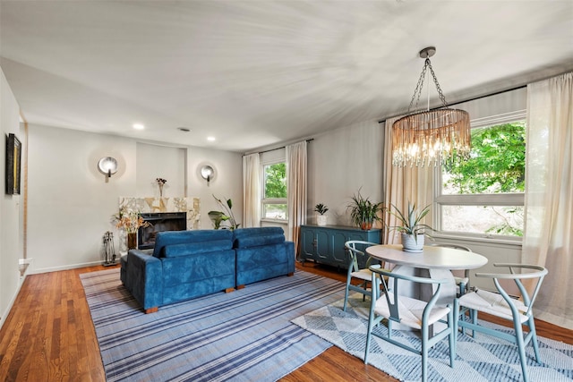 10 Spectrum Dr, Chester, NY 10918 - living room with a chandelier, wood finished floors, baseboards, a premium fireplace, and recessed lighting