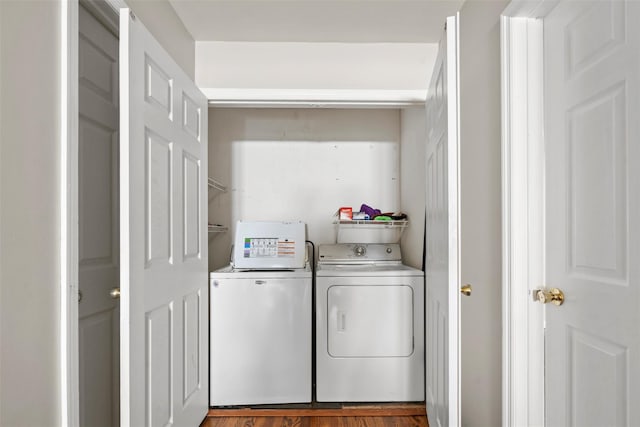 10 Spectrum Dr, Chester, NY 10918 - laundry area with washer and clothes dryer and wood finished floors