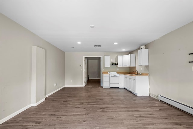 10 Spectrum Dr, Chester, NY 10918 - kitchen with white range oven, a sink, a baseboard radiator, wood finished floors, and baseboards