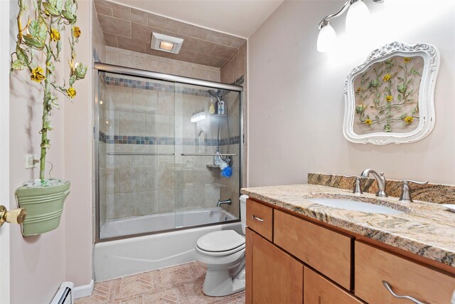 10 Spectrum Dr, Chester, NY 10918 - bathroom featuring vanity, toilet, bath / shower combo with glass door, and a baseboard heating unit
