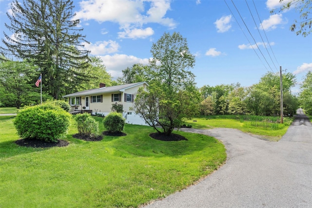 315 Scotchtown Rd, Goshen, NY 10924 - raised ranch featuring a front lawn, a chimney, and asphalt driveway