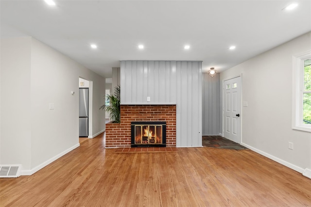 315 Scotchtown Rd, Goshen, NY 10924 - unfurnished living room with light wood-style floors, baseboards, recessed lighting, and a fireplace