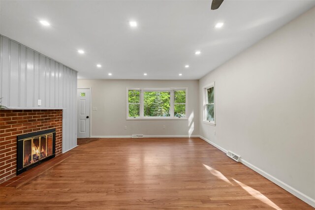 315 Scotchtown Rd, Goshen, NY 10924 - unfurnished living room featuring recessed lighting, light wood-style floors, a brick fireplace, and baseboards