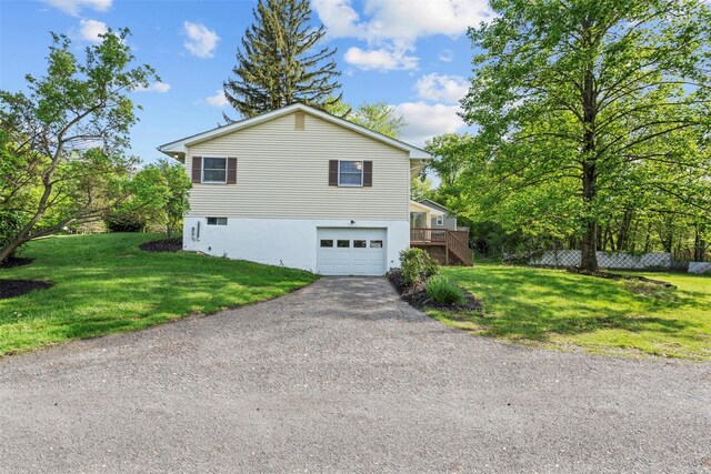 315 Scotchtown Rd, Goshen, NY 10924 - view of side of property with asphalt driveway, an attached garage, a lawn, and stairway