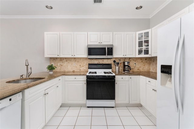 kitchen featuring white cabinetry, white appliances, a sink, and glass insert cabinets