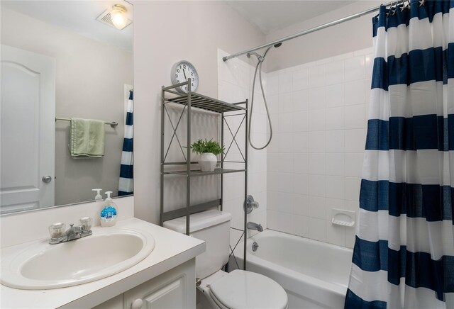 bathroom with toilet, shower / tub combo with curtain, vanity, and visible vents