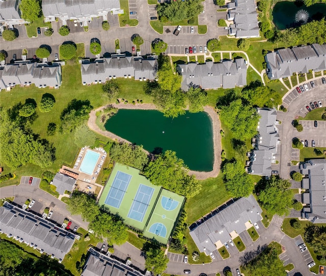 drone / aerial view featuring a water view and a residential view