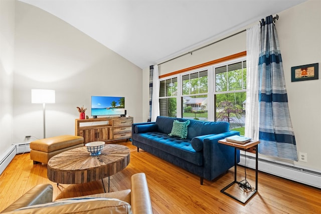 living room with a baseboard heating unit, lofted ceiling, and wood finished floors